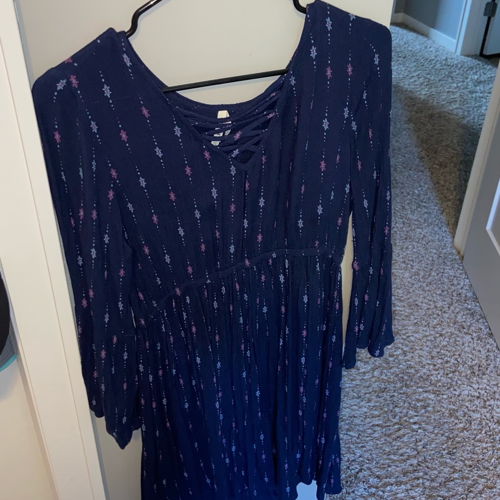 Navy with light blue and purple designs. Medium